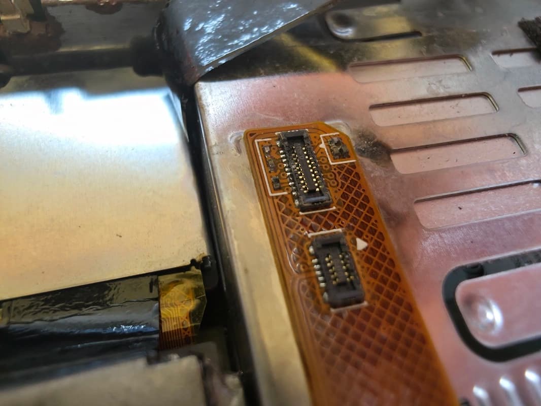 Internal flex cables and connectors of a GoPro camera after water damage repair